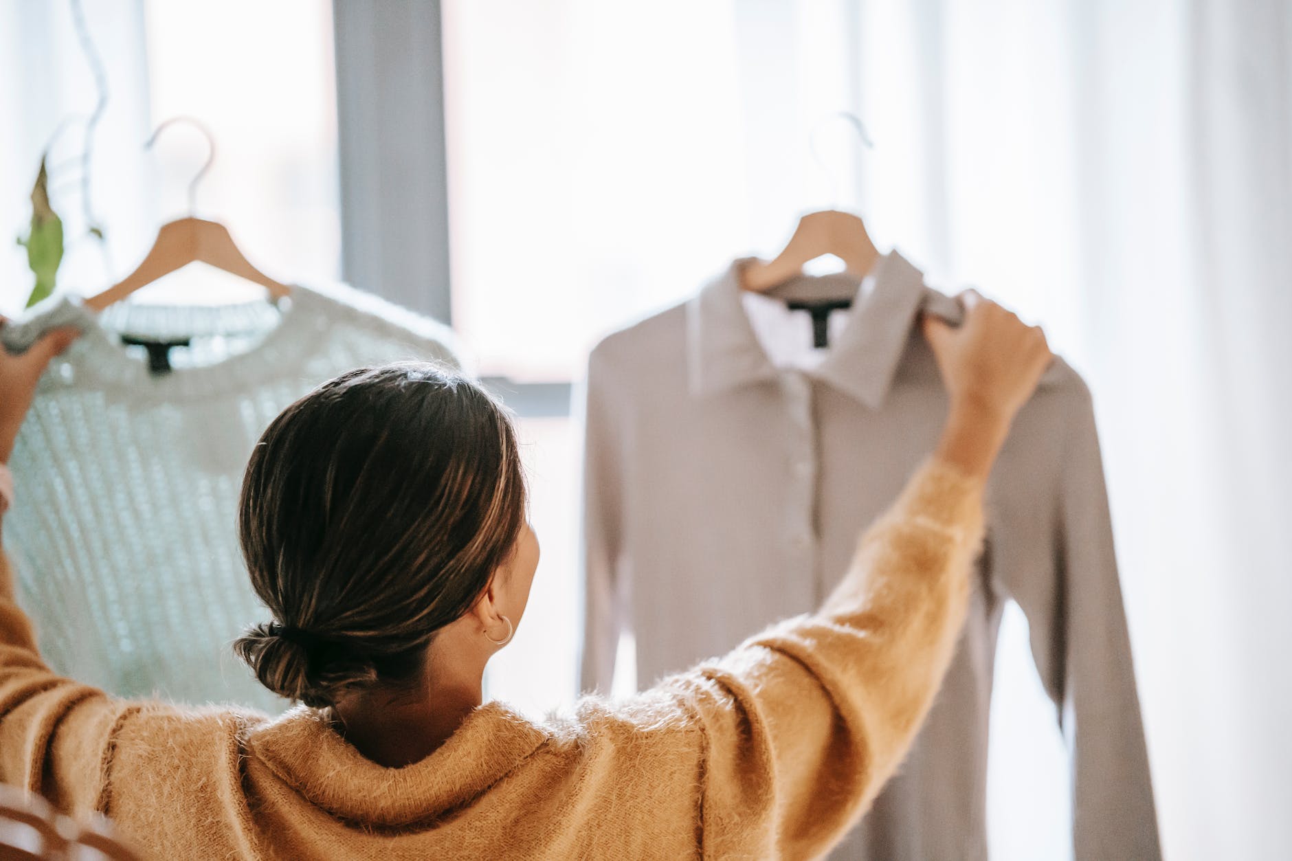 woman choosing clothes in store