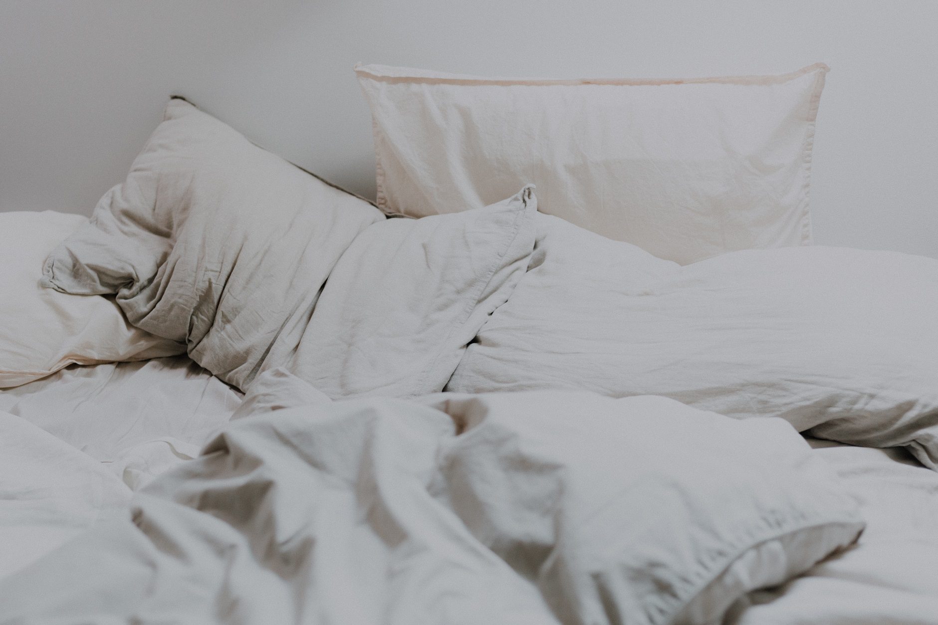 white bedding and white pillowcase