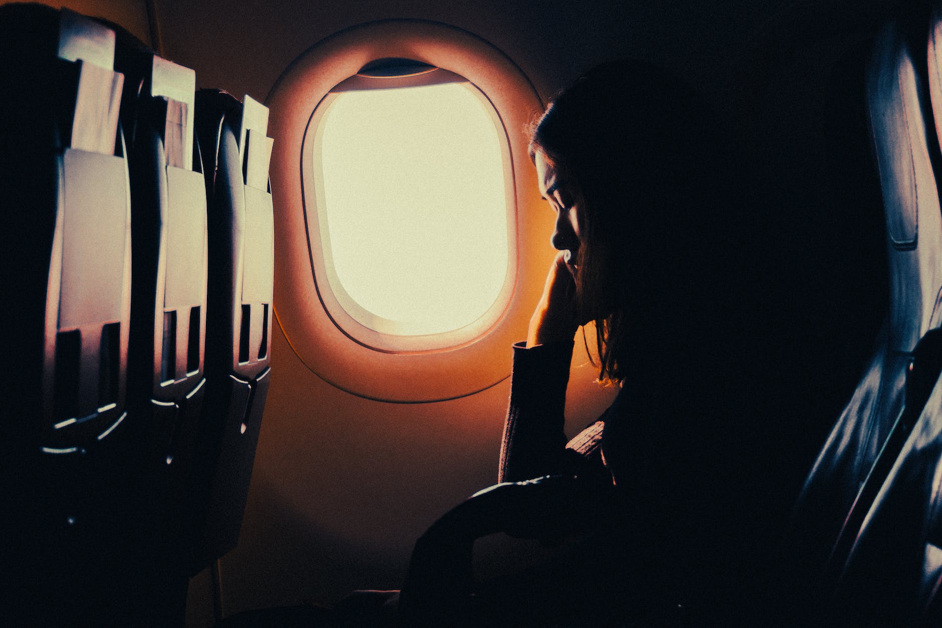 Woman in airplane with sunshine